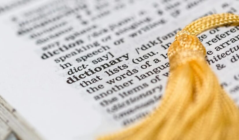 A dictionary entry for "dictionary" with a gold tassel