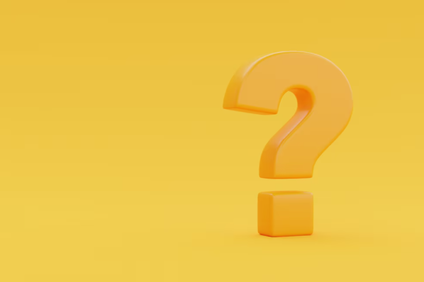 A glossy orange question mark on a yellow background